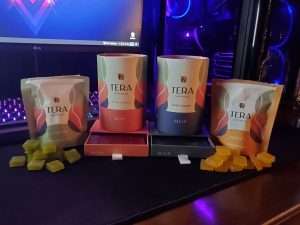 Tera Naturals four different gummy products with blue and purple computer and keyboard in the background
